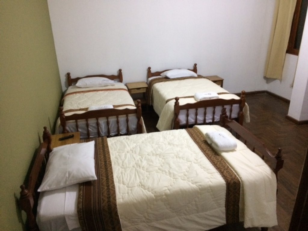 Single bed in male dorm with shared bathroom